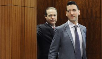 FILE - In this April 29, 2016, file photo, David Daleiden, right, leaves a courtroom with attorney Jared Woodfill after a hearing in Houston. Planned Parenthood has made an unusual legal demand to join California&#39;s criminal prosecution of two anti-abortion activists charged with invasion of privacy for secretly making videos as they tried to buy fetal material from the organization. (AP Photo/Pat Sullivan, File)
