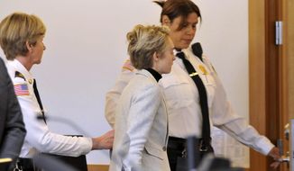 Michelle Carter, 22, center,  is led away by court officers after a hearing on her prison sentence in Taunton District Court in Taunton, Mass. Monday, February 11, 2019. Carter was jailed Monday on an involuntary manslaughter conviction. She was convicted in 2017 of involuntary manslaughter and sentenced to a 15 month prison term for encouraging 18-year-old Conrad Roy, III to kill himself when she instructed him over the phone to get back in his truck that was filling with toxic gas in July 2014.  (Mark Stockwell/The Sun Chronicle via AP, Pool)