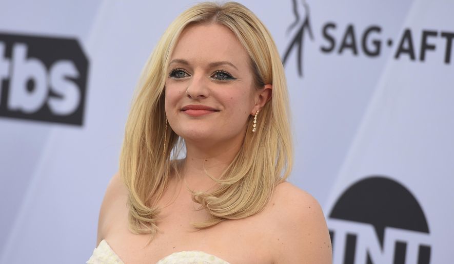FILE - In a Jan. 27, 2019 file photo, Elisabeth Moss arrives at the 25th annual Screen Actors Guild Awards at the Shrine Auditorium &amp;amp; Expo Hall, in Los Angeles. Hulu said Monday, Feb. 11, 2019 that the dystopian drama  “The Handmaid’s Tale” will debut three new episodes on Wednesday, June 5. (Photo by Jordan Strauss/Invision/AP, File)