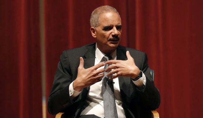 Former Attorney General Eric Holder speaks at Drake University, Tuesday, Feb. 12, 2019, in Des Moines, Iowa. (AP Photo/Charlie Neibergall) ** FILE **