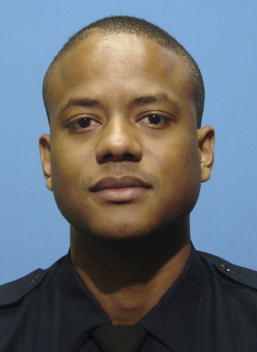 FILE - This undated file photo provided by the Baltimore Police Department shows Jemell Rayam. Rayam, a disgraced Baltimore police detective who led a double life as a drug gang collaborator, has been sentenced to 10 years in federal prison for his role on an out-of-control unit of city officers who resold looted narcotics, conducted brazen robberies, and falsified evidence. (Baltimore Police Department via AP, File)