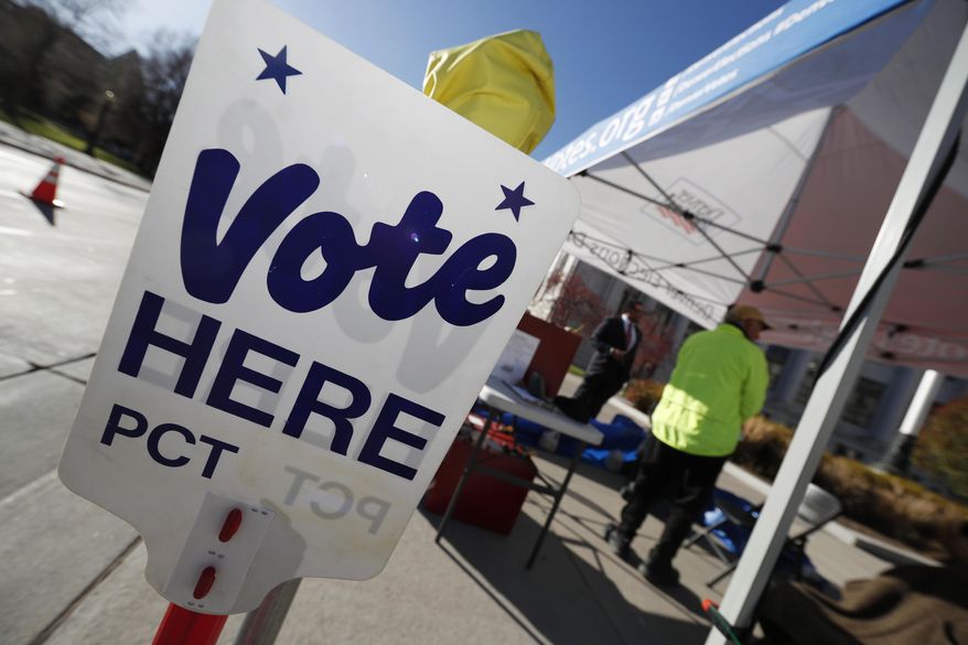 In this Nov. 6, 2018, file photo a sign directs voters to the Denver Elections Division drop off location in front of the City/County Building in Denver. Colorado&#x27;s Democrat-controlled Legislature is rushing a bill to have the state join others in casting its electoral votes for the winner of the national popular vote. (AP Photo/David Zalubowski, File)