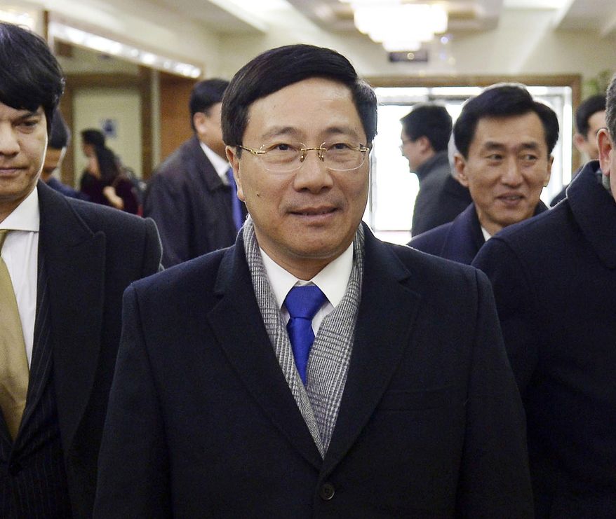 Vietnamese Foreign Minister Pham Binh Minh arrives at Pyongyang International Airport in Pyongyang, North Korea, Tuesday, Feb. 12, 2019. Pham visited Pyongyang for meetings ahead of the next summit between U.S. President Donald Trump and North Korean leader Kim Jong Un scheduled for Feb. 27-28. (Kyodo News via AP)