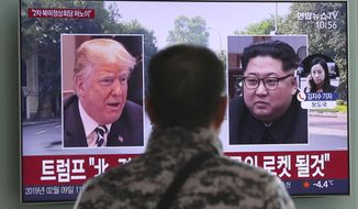 In this Feb. 9, 2019, photo, a man watches a TV screen showing images of U.S. President Donald Trump, left, and North Korean leader Kim Jong Un during a news program at the Seoul Railway Station in Seoul, South Korea. A top U.S. commander says he’s seen little to no change in North Korea’s military readiness or a slowdown in its nuclear weapons program since President Donald Trump and Kim Jong Un met for nuclear talks last year. (AP Photo/Ahn Young-joon)