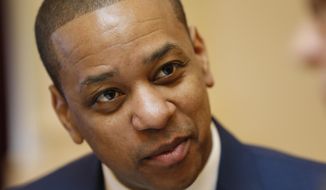 Virginia Lt. Gov. Justin Fairfax is prepped for the Senate session at the Capitol in Richmond, Va., Tuesday, Feb. 12, 2019. Vanessa Tyson, a college professor who has accused Fairfax of sexual assault, will appear Tuesday at a long-planned Stanford University academic symposium on that topic. (AP Photo/Steve Helber)