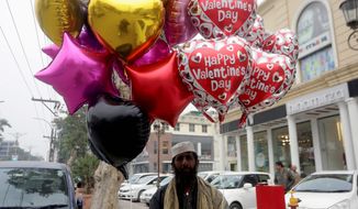 A Pakistani vendor waits for customers to sell balloons ahead of the Valentine&#39;s Day in Lahore, Pakistan, on Wednesday. Celebrating Valentine&#39;s Day is considered &quot;un-Islamic&quot; by some in Pakistan, but many still exchange gifts with others. One university has rebranded it as &quot;Sister&#39;s Day&quot; and gained notoriety for doing so. (Associated Press)