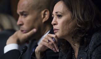 In this Sept. 27, 2018, file photo, Sen. Cory Booker, D-N.J., and Sen. Kamala Harris, D-Calif., listen as Dr. Christine Blasey Ford testifies during the Senate Judiciary Committee hearing on the nomination of Brett M. Kavanaugh to be an associate justice of the Supreme Court of the United States, focusing on allegations of sexual assault by Kavanaugh against Christine Blasey Ford in the early 1980s. (Tom Williams/Pool Photo via AP)