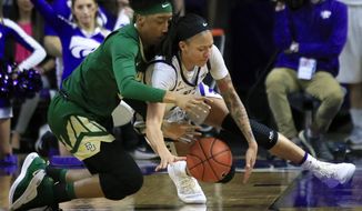 Baylor forward Aquira DeCosta, left, and Kansas State forward Jasauen Beard, right, dive for a loose ball during the second half of an NCAA college basketball game in Manhattan, Kan., Wednesday, Feb. 13, 2019. Baylor defeated Kansas State 71-48. (AP Photo/Orlin Wagner)