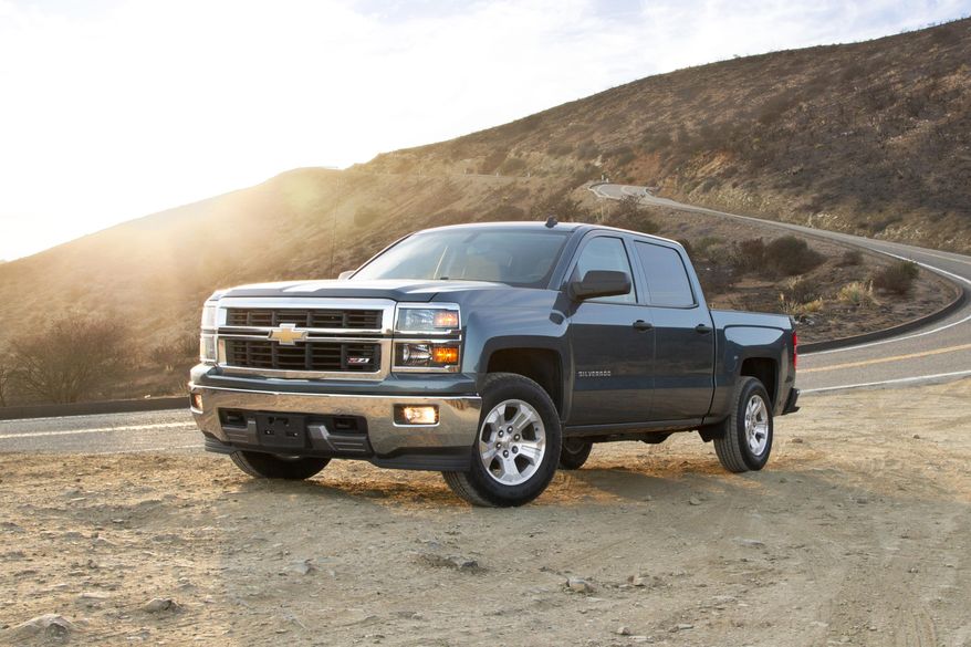 This undated photo provided by Edmunds shows a 2014 Chevrolet Silverado 1500 Z71. When Edmunds bought the truck for its long-term vehicle testing fleet in July 2013, the editors doing the buying had to negotiate out the cost of dealer-installed but unwanted additional equipment, including wheel locks, an exhaust tip and a door-edge protector. Not having a plan for how to deal with these last-minute items can lead to overspending, a mistake many shoppers make. (Edmunds via AP)