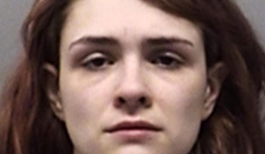 This undated photo provided by the From Wise County Sheriff’s Office shows Paige Isabow Harkings. Deputies on Tuesday, Feb. 12, 2019, discovered two malnourished children crammed into a locked dog cage and two more smeared with feces and urine in a barn in North Texas, in what a sheriff described as the worst case of child abuse he has ever seen. Joseph Fabila and Harkings, the mother of the four children, have been jailed without bond after the children were found at their rural home. (From Wise County Sheriff’s Office via AP)
