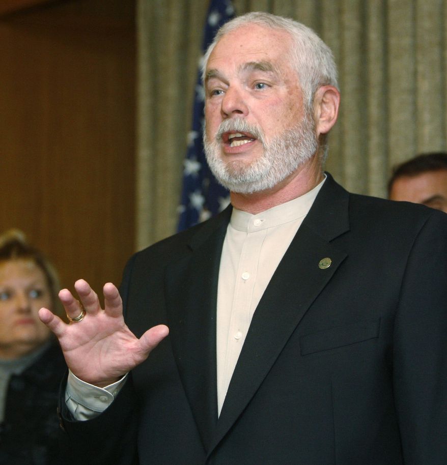 FILE - In this Nov. 29, 2010, file photo, Charles Lamb, Mayor Pro Tem and Council Member for the city of Edmond, Okla., answers a question at a news conference in Oklahoma City. Lamb, the late mayor of the Oklahoma City suburb, who died in December, has advanced to the general election following a Facebook campaign supporting him. Lamb's name will be on the April 2nd general election ballot with former Mayor Dan O'Neil, after Lamb finished second to O'Neil in the three-person race Tuesday. If the late Lamb is elected, the City Council would appoint a mayor. (AP Photo/Sue Ogrocki, File)