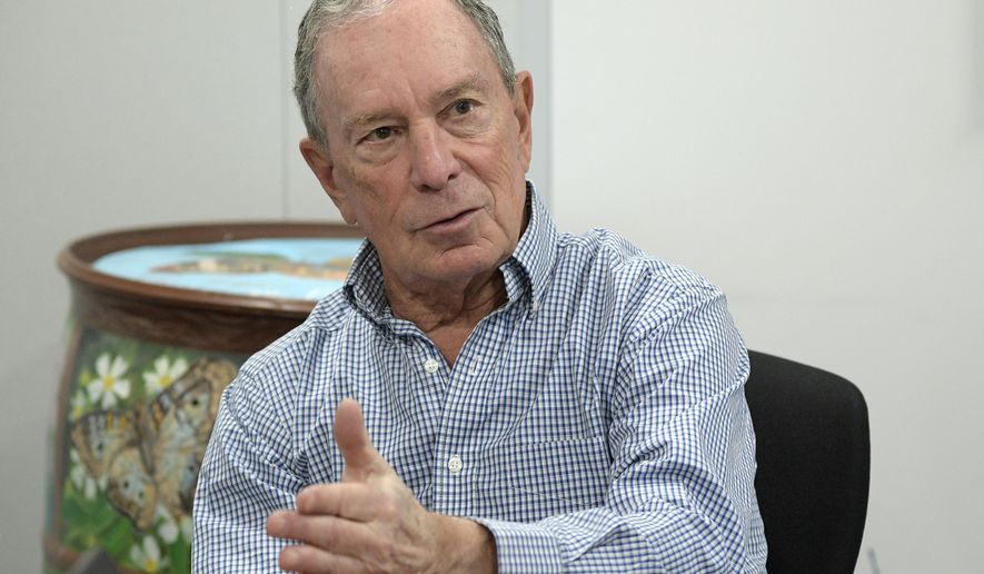 FILE - In this Feb. 8, 2019, photo, former New York City Mayor Michael Bloomberg answers an question during an interview with The Associated Press in Orlando, Fla. Bloomberg measures his progress on climate change in metric tons. His political party, it seems, prefers big ideas. Many Democratic presidential contenders embraced the “Green New Deal” immediately after it was released last week. (AP Photo/Phelan M. Ebenhack)