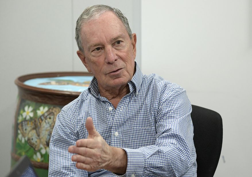 FILE - In this Feb. 8, 2019, photo, former New York City Mayor Michael Bloomberg answers an question during an interview with The Associated Press in Orlando, Fla. Bloomberg measures his progress on climate change in metric tons. His political party, it seems, prefers big ideas. Many Democratic presidential contenders embraced the “Green New Deal” immediately after it was released last week. (AP Photo/Phelan M. Ebenhack)