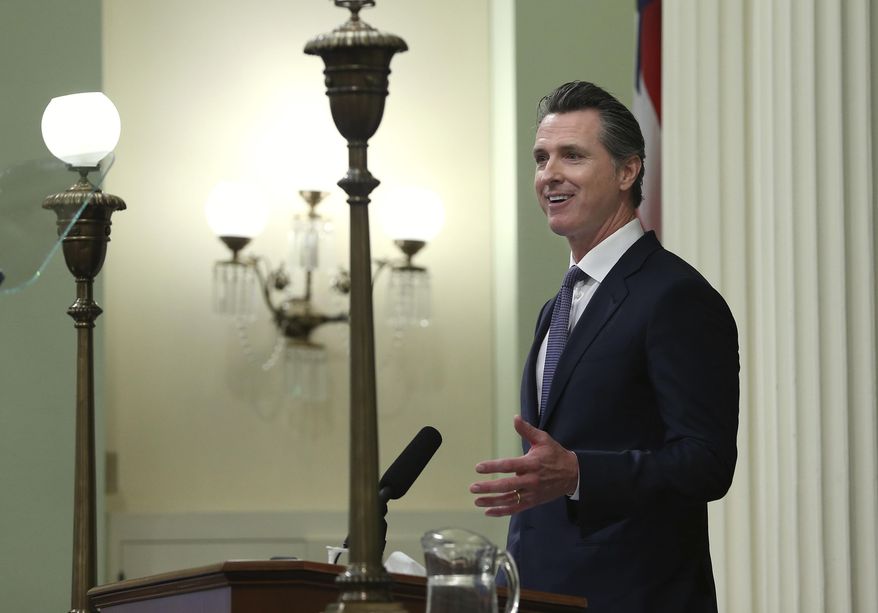 File - In this Feb. 12, 2019 file photo, California Gov. Gavin Newsom delivers his first state of the state address to a joint session of the legislature at the Capitol in Sacramento, Calif. Newsom devoted part of his first State of the State address to attacking President Donald Trump's positions on illegal immigration, declaring, "This border emergency is nothing more than a manufactured crisis and California will not be part of this political theater." (AP Photo/Rich Pedroncelli, File)