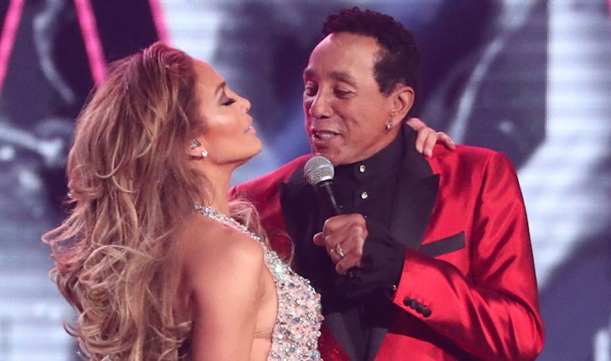 Jennifer Lopez, left, and Smokey Robinson perform a medley during a tribute to Motown's 60th anniversary at the 61st annual Grammy Awards on Sunday, Feb. 10, 2019, in Los Angeles. (Photo by Matt Sayles/Invision/AP)
