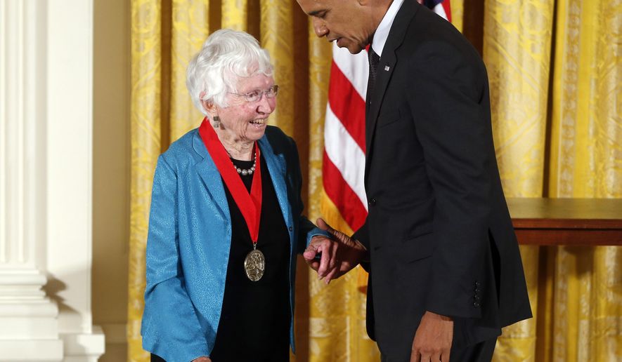 FILE - In this July 28, 2014 file photo President Barack Obama awards the 2013 National Humanities Medal to historian Anne Firor Scott from Chapel Hill, N.C., during a ceremony in the East Room at the White House in Washington. Anne Firor Scott, a prize-winning historian and esteemed professor who upended the male-dominated field of Southern scholarship by pioneering the study of Southern women, has died. She was 97. Her death was announced last week by Duke University, where she taught for three decades. The citation for her humanities medal praised her "groundbreaking research spanning ideology, race, and class." (AP Photo/Charles Dharapak, file)