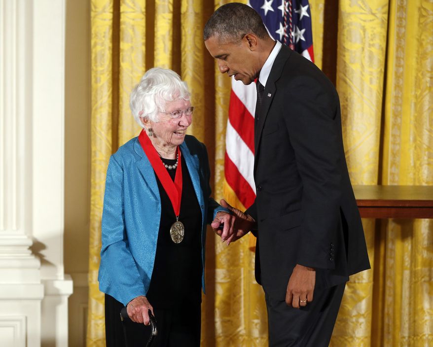 FILE - In this July 28, 2014 file photo President Barack Obama awards the 2013 National Humanities Medal to historian Anne Firor Scott from Chapel Hill, N.C., during a ceremony in the East Room at the White House in Washington. Anne Firor Scott, a prize-winning historian and esteemed professor who upended the male-dominated field of Southern scholarship by pioneering the study of Southern women, has died. She was 97. Her death was announced last week by Duke University, where she taught for three decades. The citation for her humanities medal praised her "groundbreaking research spanning ideology, race, and class." (AP Photo/Charles Dharapak, file)