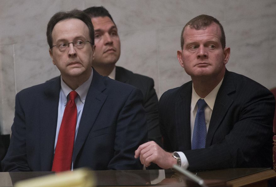FILE - In this Sept. 11, 2018 file photo, West Virginia Supreme Court justice, Allen Loughry, left, sits in the Senate chambers with his attorney John Carr, right, during a pre-trial impeachment conference in the West Virginia State Senate chambers at the Capitol in Charleston, W.Va. The former West Virginia Supreme Court justice at the center of an impeachment scandal is due in federal court for sentencing for using his office for his own benefit. Loughry is scheduled to be sentenced Wednesday, Feb. 13, 2019, in U.S. District Court in Charleston. (AP Photo/Steve Helber, File)
