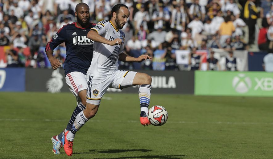 FILE - In this Dec. 7, 2014, file photo, Los Angeles Galaxy&#x27;s Landon Donovan, right, controls the ball past New England Revolution&#x27;s Andrew Farrell during the first half of the MLS Cup championship soccer match in Carson, Calif. Donovan doesn&#x27;t look at it as coming out of retirement, since he never really considered himself retired. Donovan, the former U.S. national team and MLS star, will make his debut for the San Diego Sockers of the Major Arena Soccer League on Friday, Feb. 15, 2019, night against the Tacoma Stars. (AP Photo/Jae C. Hong,File)