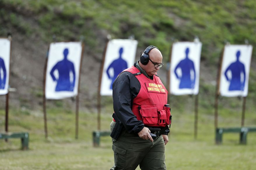 In this Jan. 30, 2019, photo, Sgt. Michael Hazellief, training supervisor, walks on the grounds where the "guardians" are participating in a training session to respond to active shooters in Okeechobee, Fla. Okeechobee is one of the Florida districts that have started training and arming non-instructional personnel in the aftermath of the Marjory Stoneman Douglas High School shooting. Authorities keep the identities of these guardians secret, citing security reasons. (AP Photo/Brynn Anderson)