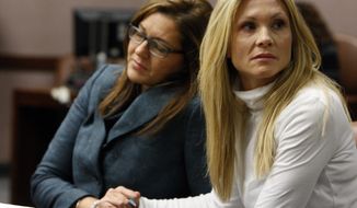 FILE - This Nov. 27, 2012 file photo shows attorney Ellen Torregrossa-O&#39;Connor, left, holding the hand of former &amp;quot;Melrose Place&amp;quot; actress Amy Locane-Bovenizer, of Hopewell Township, N.J. as the jury in her trial returns a verdict in Somerville, N.J. Locane was sentenced Friday, Feb. 15, 2019, to 5 years behind bars. She served about 2½ years before her 2015 release. An appeals court ordered Locane to be re-sentenced after determining her initial sentence was too lenient. (Robert Sciarrino/The Star-Ledger, Pool via AP. File)