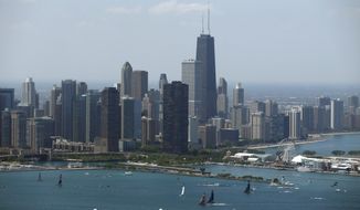 Sailboats practice in front of the downtown Chicago skyline during practice for an America&#x27;s Cup World Series sailing event, June 10, 2016. (AP Photo/Kiichiro Sato) ** FILE **