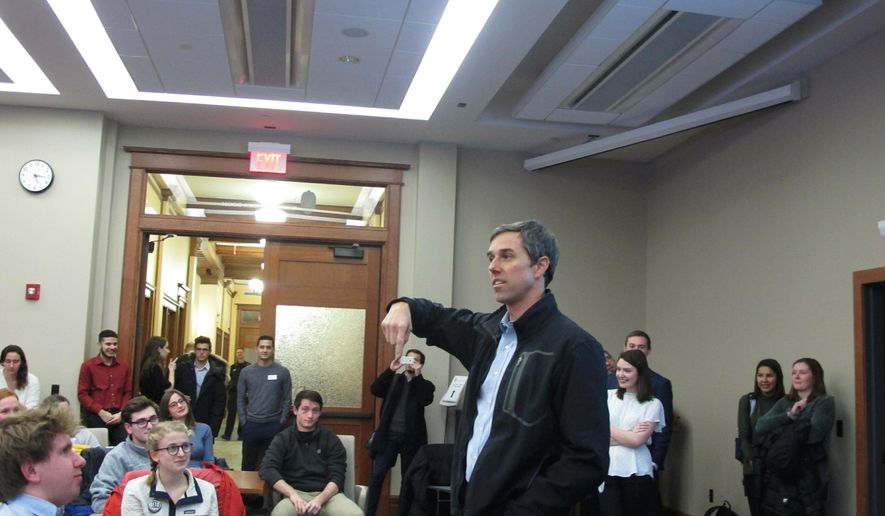 Potential 2020 Democratic presidential candidate Beto O'Rourke stops by an overflow room to thank University of Wisconsin-Madison students who came to hear him speak at an event that attracted more than 200 people on Friday, Feb. 15, 2019, in Madison, Wis. (AP Photo/Scott Bauer)