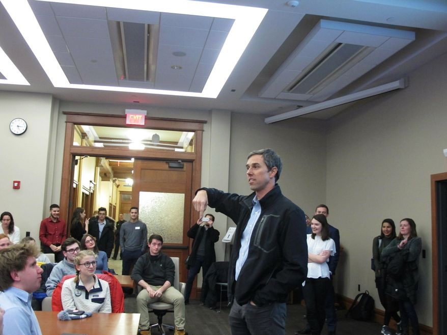 Potential 2020 Democratic presidential candidate Beto O'Rourke stops by an overflow room to thank University of Wisconsin-Madison students who came to hear him speak at an event that attracted more than 200 people on Friday, Feb. 15, 2019, in Madison, Wis. (AP Photo/Scott Bauer)