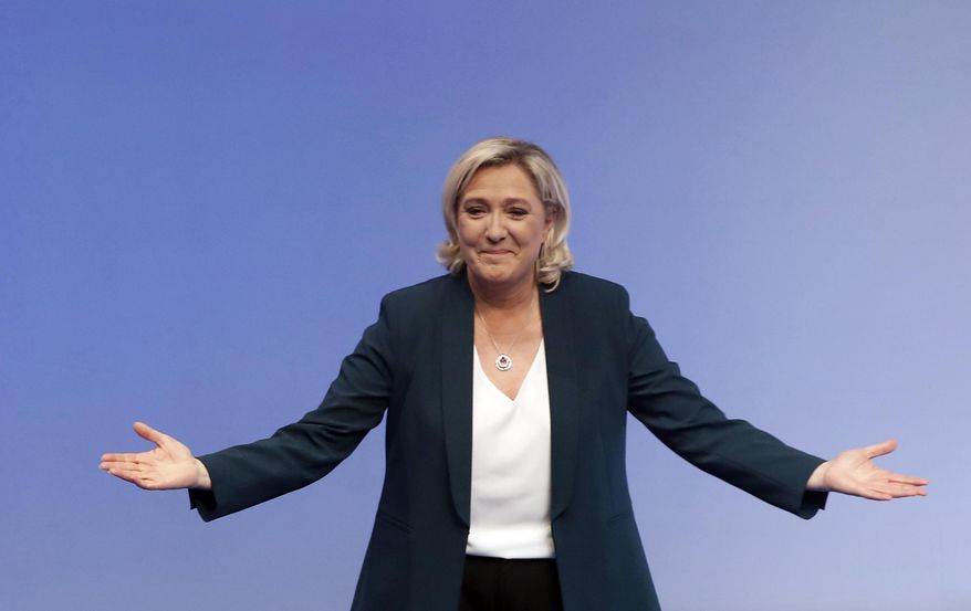 FILE In this Jan. 13, 2019 file photo, French far-right leader Marine le Pen arrives for a campaign meeting in Paris. Where once she felt isolated, French far-right leader Marine Le Pen feels she is now part of a crowd, populist parties on the rise around Europe that can make new inroads in European elections less than 100 days away _ and start to restructure the EU from within. (AP Photo/Christophe Ena, File)