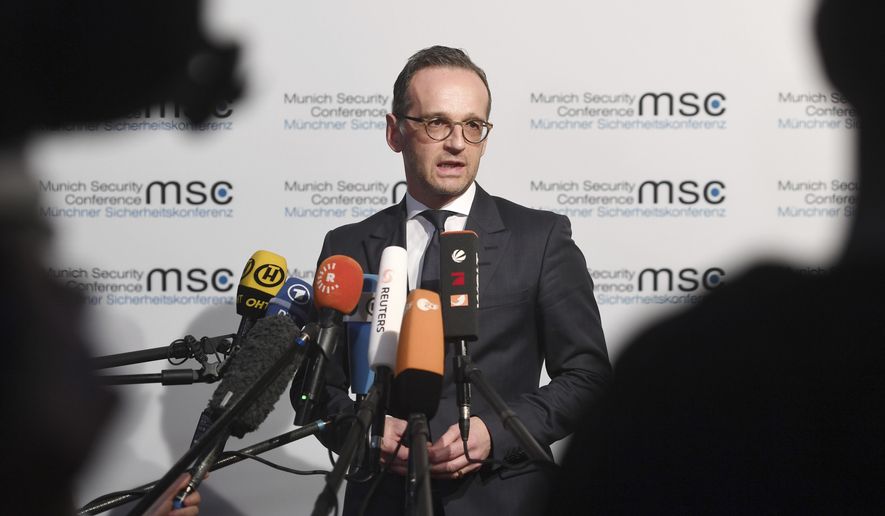 German Minister of Foreign Affairs Heiko Maas talks to the media at the Munich Security Conference in Munich, Germany, Friday, Feb. 15, 2019. (Tobias Hase/dpa via AP)