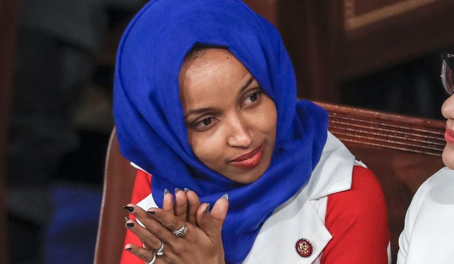 In this Feb. 5, 2019, file photo, Rep. Ilhan Omar, D-Minn., listens to President Donald Trump&#x27;s State of the Union speech, at the Capitol in Washington. In Omar&#x27;s Minnesota district, both Jews and Muslims voiced concern about an inflammatory tweet on Israel that had the congresswoman apologizing within hours. While some Jews said she was being unfairly judged, others said they feared she was being slow to learn from previous criticism. (AP Photo/J. Scott Applewhite, File)