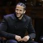 FILE - In this Oct. 11, 2018, file photo, former NFL football quarterback Colin Kaepernick smikes on stage during W.E.B. Du Bois Medal ceremonies at Harvard University, in Cambridge, Mass. Colin Kaepernick and Eric Reid have reached settlements on their collusion lawsuits against the NFL, the league said Friday, Feb. 19, 2019. (AP Photo/Steven Senne, File) **FILE**