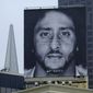 In this Sept. 5, 2018, file photo, a large billboard stands on top of a Nike store showing former San Francisco 49ers quarterback Colin Kaepernick, at Union Square in San Francisco. (AP Photo/Eric Risberg, File)