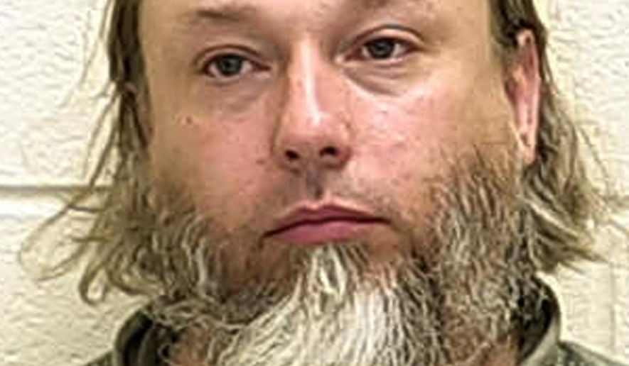 FILE - This undated photo provided by The Ford County Sheriff's Office in Paxton, Ill., shows Michael Hari, who pleaded not guilty, Thursday, Feb. 14, 2019, in federal court in St. Paul, Minn., in the bombing of a Minnesota mosque, three weeks after two of his alleged accomplices pleaded guilty. Federal prosecutors allege Hari was the ringleader of an Illinois-based militia and that the trio drove more than 500 miles to bomb the mosque in hopes of scaring Muslims into leaving the U.S. No one was injured in the August 2017 attack. (Ford County Sheriff's Office via AP, File)