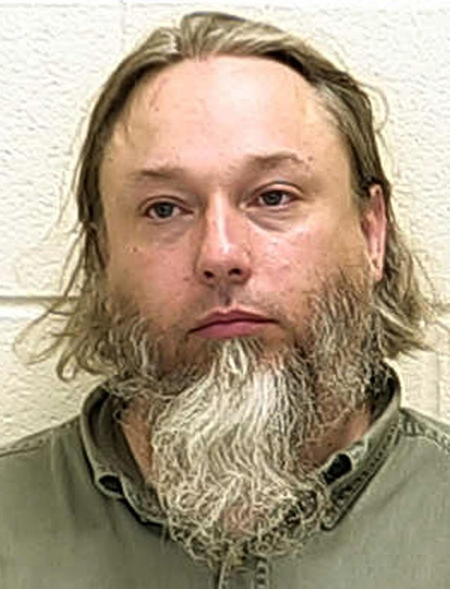 FILE - This undated photo provided by The Ford County Sheriff's Office in Paxton, Ill., shows Michael Hari, who pleaded not guilty, Thursday, Feb. 14, 2019, in federal court in St. Paul, Minn., in the bombing of a Minnesota mosque, three weeks after two of his alleged accomplices pleaded guilty. Federal prosecutors allege Hari was the ringleader of an Illinois-based militia and that the trio drove more than 500 miles to bomb the mosque in hopes of scaring Muslims into leaving the U.S. No one was injured in the August 2017 attack. (Ford County Sheriff's Office via AP, File)