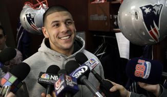 FILE - In this Jan. 26, 2012, file photo, New England Patriots tight end Aaron Hernandez speaks to reporters at his locker at the NFL football stadium in Foxborough, Mass. A federal judge says the 6-year-old daughter of deceased NFL player Aaron Hernandez missed a 2014 deadline to opt out of the $1 billion concussion settlement and can&#39;t separately sue the league over his CTE diagnosis. Yet Hernandez’s death in 2017 came too late for his family to seek compensation for CTE-related suicides under the class action settlement.   (AP Photo/Elise Amendola, File)