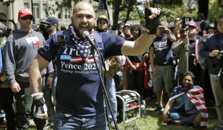 FILE - In this April 27, 2017, file photo, Joey Gibson speaks during a rally in support of free speech in Berkeley, Calif. The mayor of Portland, Oregon, has asked the police chief to investigate &amp;quot;disturbing&amp;quot; texts between the commander of the department&#39;s rapid response team and Gibson the leader of a far-right group involved in violent protests in the city. (AP Photo/Marcio Jose Sanchez, File)