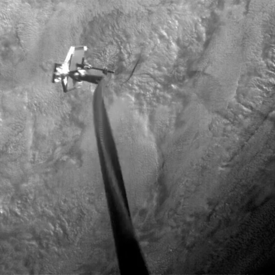 This Feb. 8, 2019 image from video made available by the RemoveDEBRIS Consortium shows a harpoon striking a square target mounted 1.5 meters (5 feet) from the RemoveDEBRIS spacecraft. The same team used a net to capture a piece of space junk, in a test last September. (RemoveDEBRIS Consortium via AP)