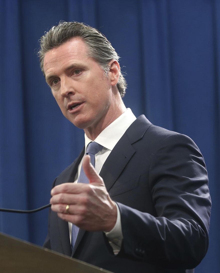 California Gov. Gavin Newsom discusses the lawsuit the state will likely file against President Donald Trump over his emergency declaration to fund a wall on the U.S.-Mexico border Friday, Feb. 15, 2019, in Sacramento, Calif. Newsom says there is no emergency at the border and Trump doesn't have the authority to make the declaration. (AP Photo/Rich Pedroncelli)