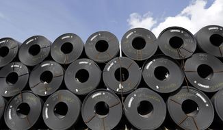 FILE - In this June 5, 2018, file photo, rolls of steel are shown in Baytown, Texas. Despite President Donald Trump&#39;s tough talk on trade, his administration has granted hundreds of companies permission to import millions of tons of steel made in China, Japan and other countries without paying the hefty tariff he put in place to protect U.S. manufacturers and jobs, according to an Associated Press analysis.(AP Photo/David J. Phillip, File)