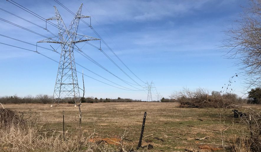 This Jan. 31, 2018 photo shows a utility corridor which runs through Freestone County, Texas, near Fairfield, in a small community of Cotton Gin. Texas Central Partners is planning to build its 240-mile high-speed rail line between Houston and Dallas along the corridor. (Dug Begley/Houston Chronicle via AP)