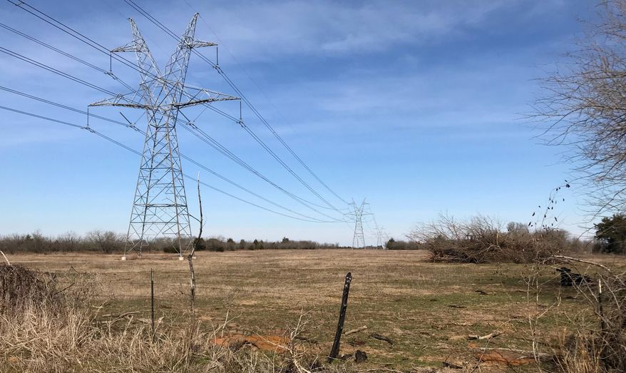 This Jan. 31, 2018 photo shows a utility corridor which runs through Freestone County, Texas, near Fairfield, in a small community of Cotton Gin. Texas Central Partners is planning to build its 240-mile high-speed rail line between Houston and Dallas along the corridor. (Dug Begley/Houston Chronicle via AP)