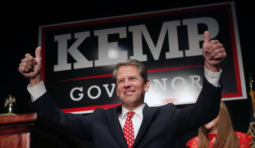 FILE - In a Nov. 7, 2018 file photo, Georgia Republican gubernatorial candidate Brian Kemp gives a thumbs-up to supporters, in Athens, Ga. The action at the Georgia legislature began to pick up pace this past week as the 2019 session approaches the half-way mark. Friday, Feb. 15, 2019 marked legislative day 16 of 40. The week saw the first bill signed by the governor a measure that clarifies when vehicles can pass a school bus as well as movement around medical marijuana cultivation in the state and drone activity near prisons. (AP Photo/John Bazemore, File)