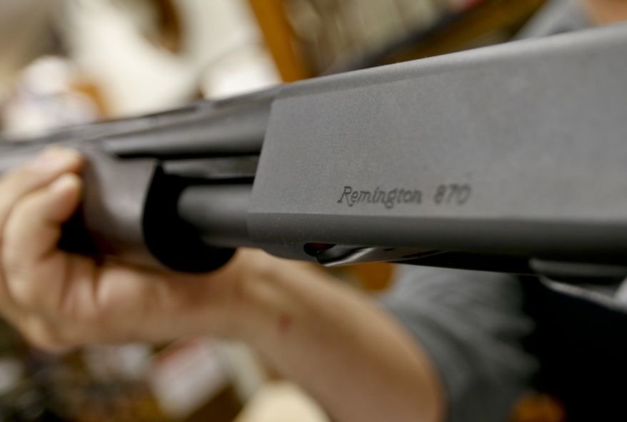 In this March 1, 2018, file photo, the Remington name is seen etched on a model 870 shotgun at Duke's Sport Shop in New Castle, Pa. Gun rights advocates say a mistake in an Ohio bill could inadvertently ban several types of legal guns and must be fixed. Gun advocates say a misplaced paragraph in the bill unintentionally lumped a variety of long guns into a prohibited category. They say lawmakers should fix the problem before the law takes effect March 28, 2019. (AP Photo/Keith Srakocic, File)