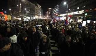 People march during a protest march against populist President Aleksandar Vucic in Belgrade, Serbia, Saturday, Feb. 16, 2019. People protested against what they say is Serbian President Aleksandar Vucic’s autocratic rule. (AP Photo/Darko Vojinovic)