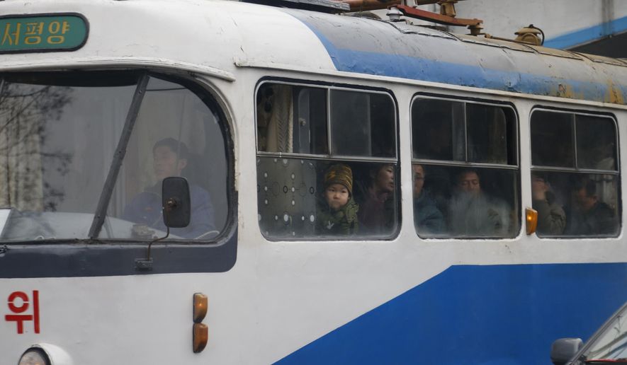 In this Sunday, Feb. 3, 2019 photo, people ride on a tram in Pyongyang, North Korea. Pyongyang is upgrading its overcrowded mass transit system with brand new subway cars, trams and buses in a campaign meant to show leader Kim Jong Un is raising the country's standard of living. (AP Photo/Dita Alangkara)
