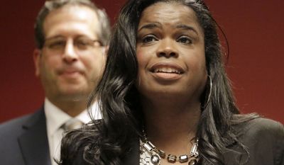 FILE - In this Dec. 2, 2015, file photo, Kim Foxx, then a candidate for Cook County state&#39;s attorney, speaks at a news conference in Chicago. Foxx, the Chicago area&#39;s top prosecutor says her office is starting a new effort to target gun crimes in city neighborhoods and revamping a branch of her office that investigates possible wrongful convictions. State&#39;s Attorney Foxx said Wednesday, March 15, 2017 that attorneys from her office are teaming up with federal prosecutors in two police districts that have some of the highest violence rates.(AP Photo/M. Spencer Green, File)