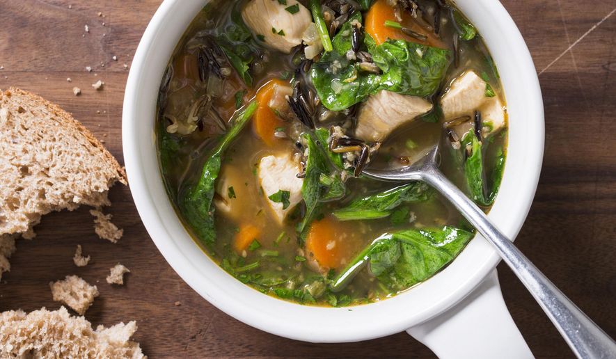 This undated photo provided by America's Test Kitchen in February 2019 shows Garlic Chicken and Wild Rice Soup in Brookline, Mass. This recipe appears in "The Complete Diabetes Cookbook." (Joe Keller/America's Test Kitchen via AP)