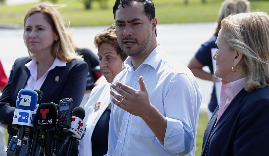 Rep. Joaquin Castro, D-Texas, second from right, chairman of the Congressional Hispanic Caucus, speaks during a news conference after touring the Homestead Temporary Shelter for Unaccompanied Children with Rep. Debbie Mucarsel-Powell, D-Fla., left, Rep. Donna Shalala, D-Fla., second from left, and Rep. Sylvia Garcia, D-Texas, right, Tuesday, Feb. 19, 2019, in Homestead, Fla. (AP Photo/Wilfredo Lee)