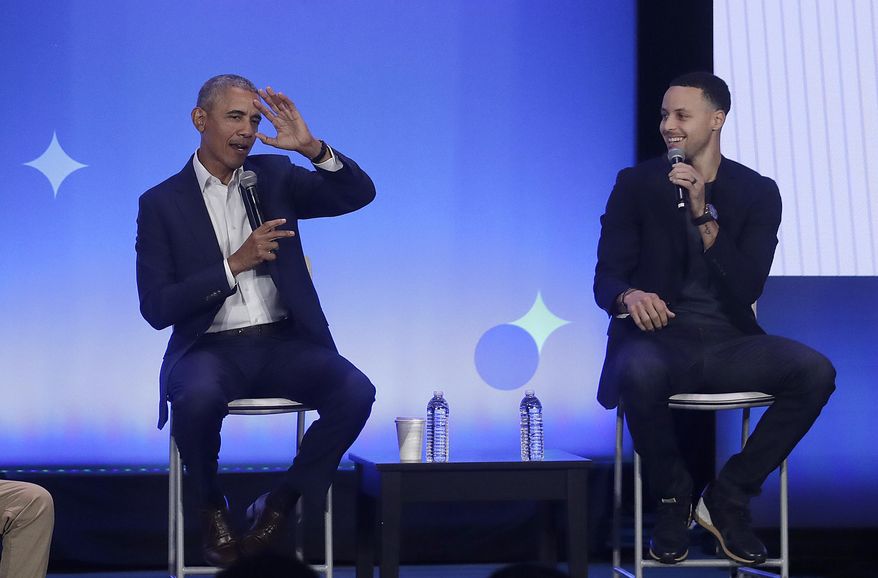 Former President Barack Obama, left, gestures as Golden State Warriors basketball player Stephen Curry laughs while speaking at the My Brother&#x27;s Keeper Alliance Summit in Oakland, Calif., Tuesday, Feb. 19, 2019. (AP Photo/Jeff Chiu) ** FILE **